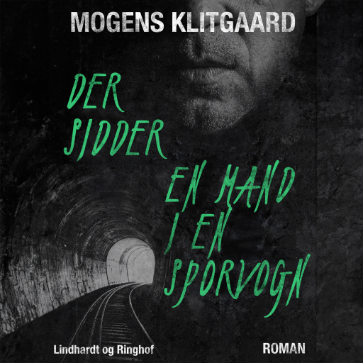 Der sidder en mand i en sporvogn